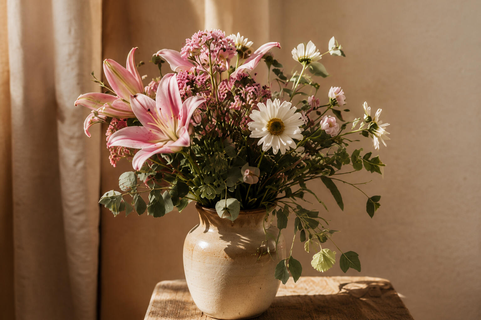 Shannon Turner, Yoga therapist & Eat, Breathe, Thrive Facilitator Natural light interior with wicker chair and flower arrangement, embodied recovery support for eating disorders